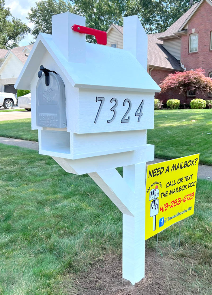 standard white wooden mailbox